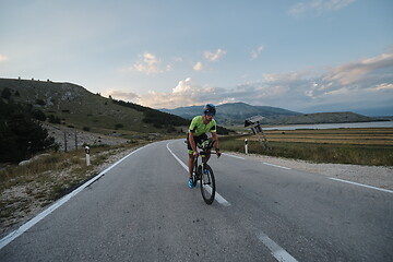 Image showing triathlon athlete riding bike