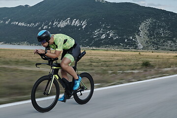 Image showing triathlon athlete riding bike