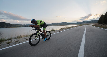 Image showing triathlon athlete riding bike