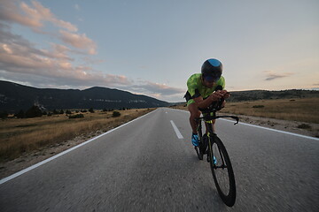 Image showing triathlon athlete riding bike