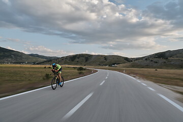 Image showing triathlon athlete riding bike