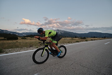 Image showing triathlon athlete riding bike