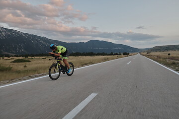 Image showing triathlon athlete riding bike