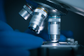 Image showing Sample slide and microscope with metal lens at laboratory.