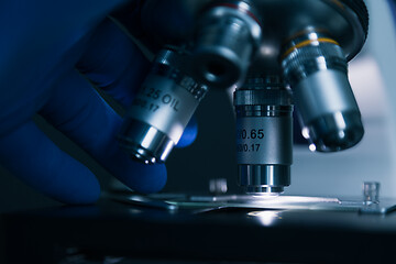 Image showing Sample slide and microscope with metal lens at laboratory.