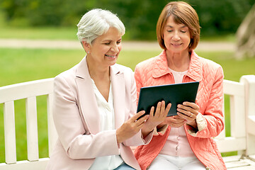 Image showing senior women with tablet pc at summer park