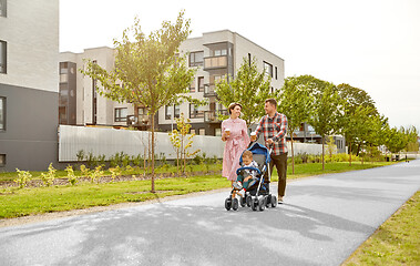 Image showing family with baby in stroller and coffee in city