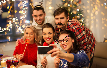 Image showing friends taking selfie at christmas dinner