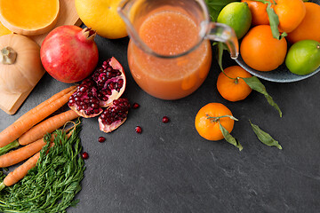 Image showing glass jug of juice with fruits and vegetables