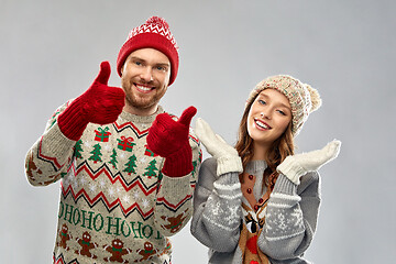 Image showing happy couple at christmas ugly sweater party