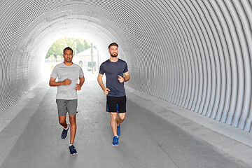 Image showing young men or male friends running outdoors