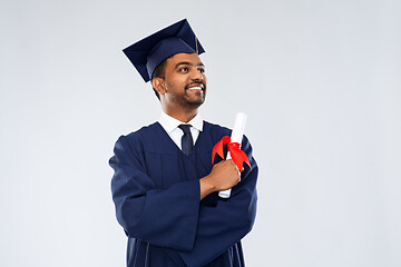 Image showing male graduate student in mortar board with diploma