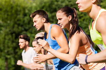 Image showing sportsmen with badge numbers on start of race