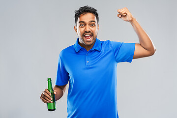 Image showing male fan with beer bottle celebrating victory