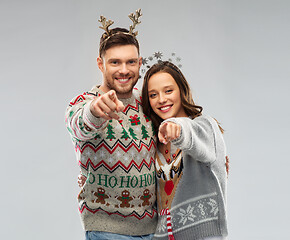 Image showing happy couple at christmas ugly sweater party