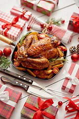 Image showing Roasted whole chicken or turkey served in iron pan with Christma