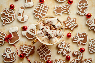 Image showing Cup of hot chocolate and Christmas shaped gingerbread cookies