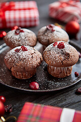 Image showing Christmas chocolate delicious muffins served on black ceramic plate