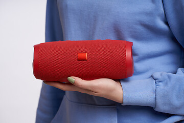 Image showing Woman hand holding portable stereo speaker