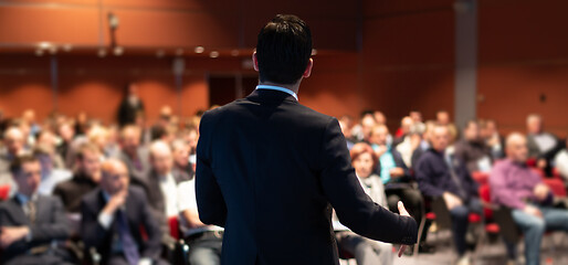 Image showing Public speaker giving talk at business event.