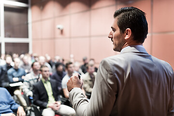 Image showing Public speaker giving talk at business event.