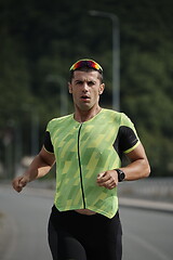 Image showing triathlon athlete running on street