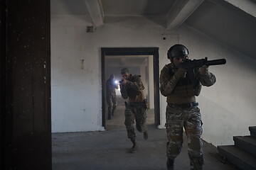 Image showing military troops in action urban environment