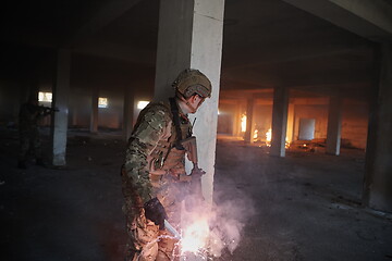 Image showing military troops in action urban environment