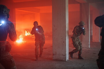 Image showing military troops in action urban environment