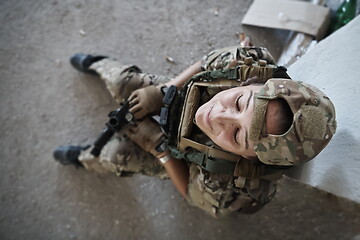 Image showing military female soldier having a break