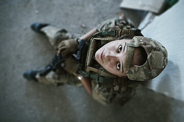 Image showing military female soldier having a break