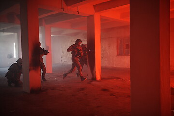 Image showing military troops in action urban environment