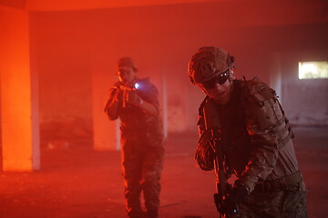 Image showing military troops in action urban environment