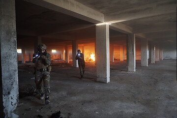 Image showing military troops in action urban environment