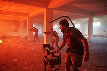 Image showing Videographer Taking Action Shoot of Soldiers in Action urban environment