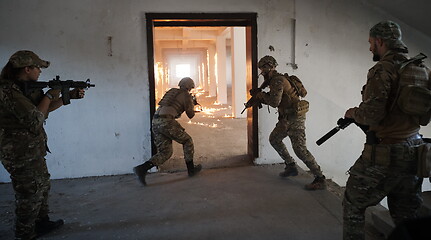 Image showing military troops in action urban environment