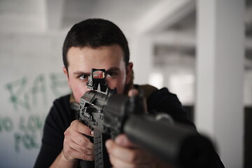 Image showing special agent soldier aiming wearing casual clothing