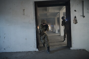 Image showing military troops in action urban environment