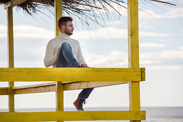 Image showing Young man enjoying the warm autumn day