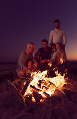 Image showing Friends having fun at beach on autumn day