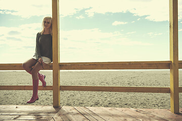 Image showing Young woman enjoying the warm autumn day