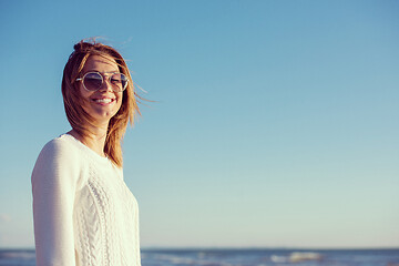 Image showing Young woman enjoying the warm autumn day