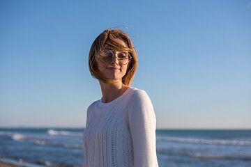 Image showing Young woman enjoying the warm autumn day