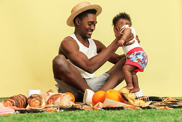 Image showing Happy family having picnic at studio