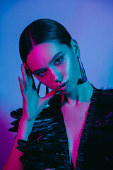 Image showing High Fashion model in colorful bright neon lights posing at studio