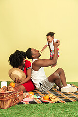 Image showing Happy family having picnic at studio