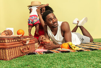 Image showing Happy family having picnic at studio