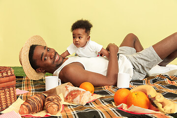 Image showing Happy family having picnic at studio