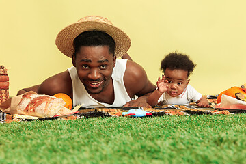 Image showing Happy family having picnic at studio