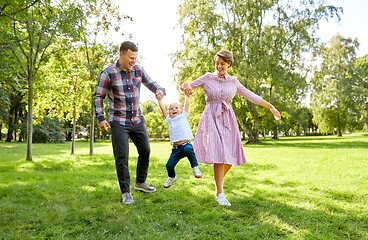 Image showing happy family having fun at summer park